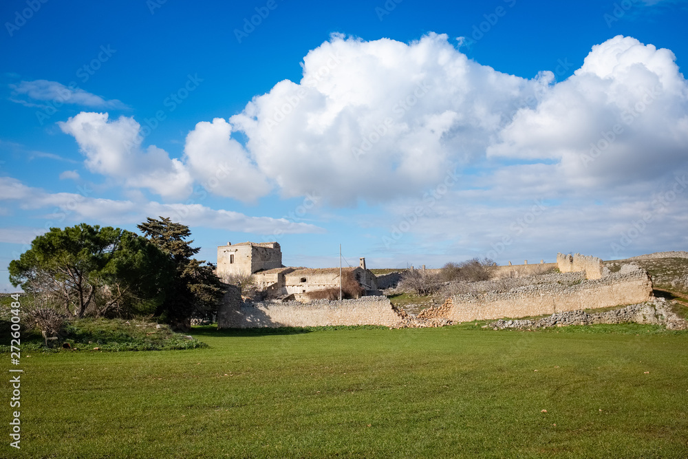 Typical Murgia landscape with an old stone manor farm called masseria. Apulia, Italy.