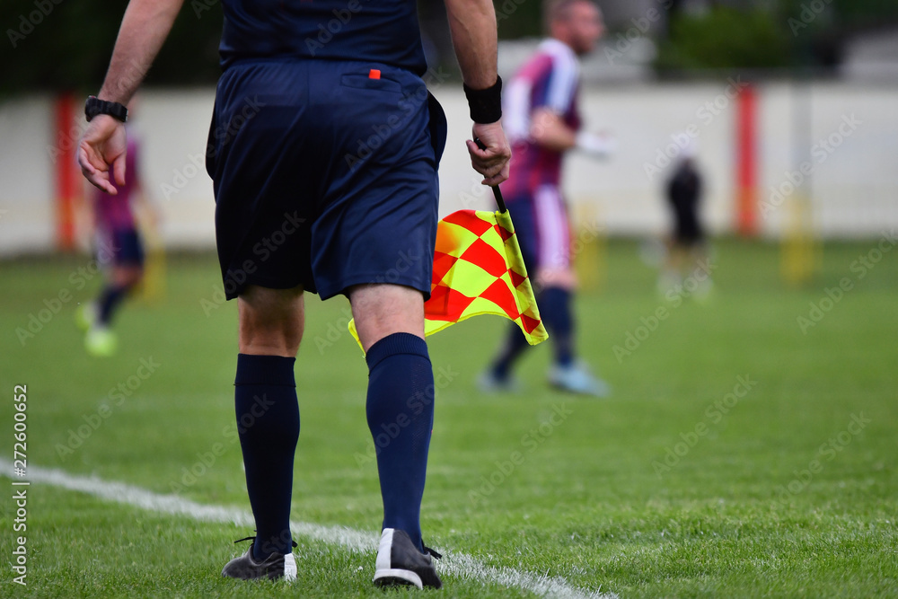 Assistant referee or Lineman of football or soccer holding flag Assistant referee or Lineman of football or soccer holding flag