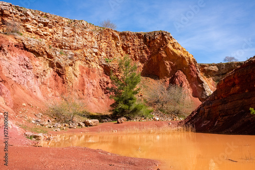 Abandoned open-pit bauxite mine with lake near Spinazzola - Apulia, Italy