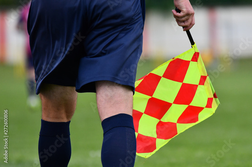 Assistant referee or Lineman of football or soccer holding flag