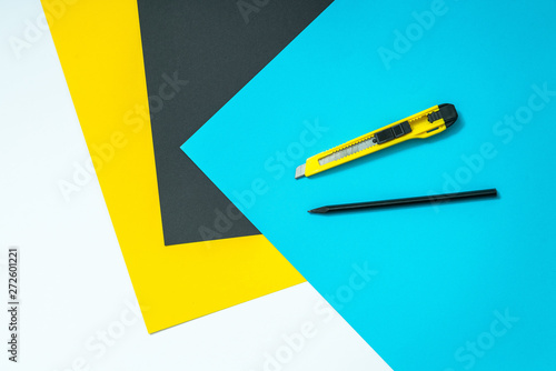 Abstract color paper and colorful papers background with pen and