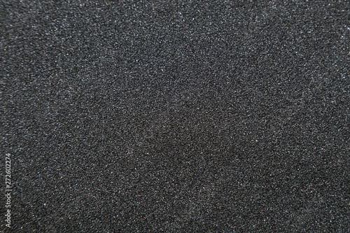 Close up of of skateboard grip tape. Macro photograph of sandpap photo