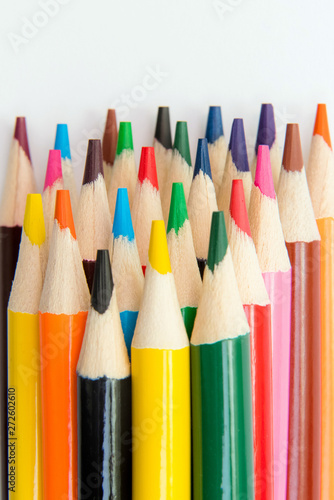 An assortment of colour pencils on white background. School supp