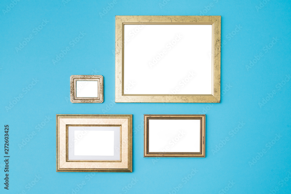 Blank empty golden frames on blue background. Art gallery, museu Blank empty golden frames on blue background. Art gallery, museu