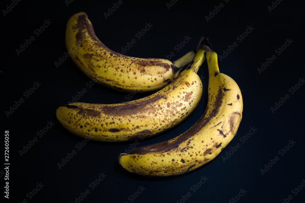 Top view of brown spotted bananas. Banana with dark black spots Top view of brown spotted bananas. Banana with dark black spots