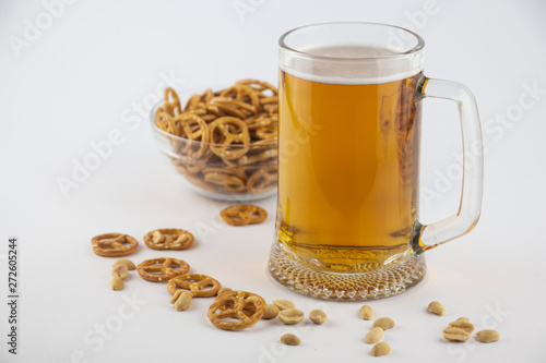 Bright, cold beer in a glass beaker and cracker