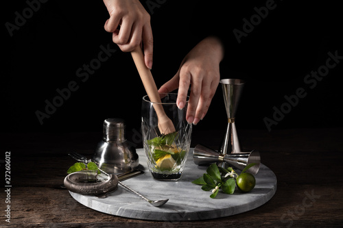 bartender equipment shaker strainer jigger on wood background with copy space photo