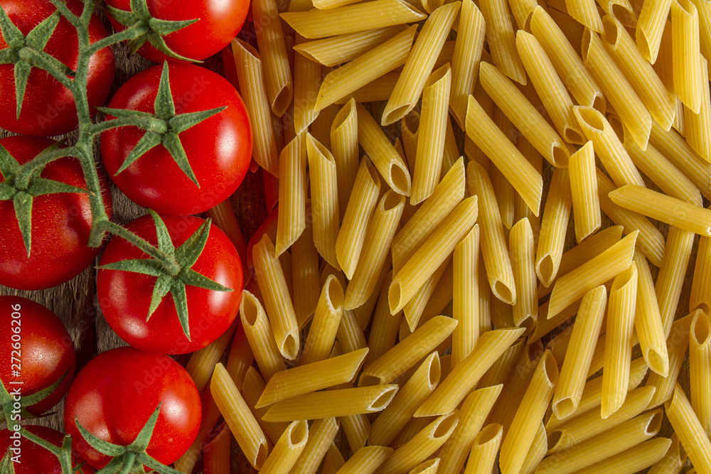 Top view of macaroni next to tomatoes