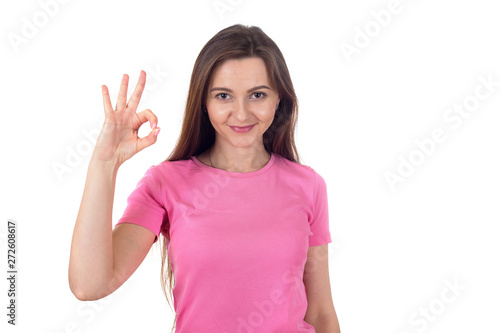 Great, very good. Portrait young woman showing hand gesture okay isolated on white background. © A Stock Studio