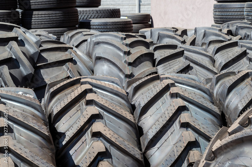 Stack of big car tires outside