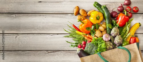 Obraz  z motywem Vegetables falling out of tipped over bag