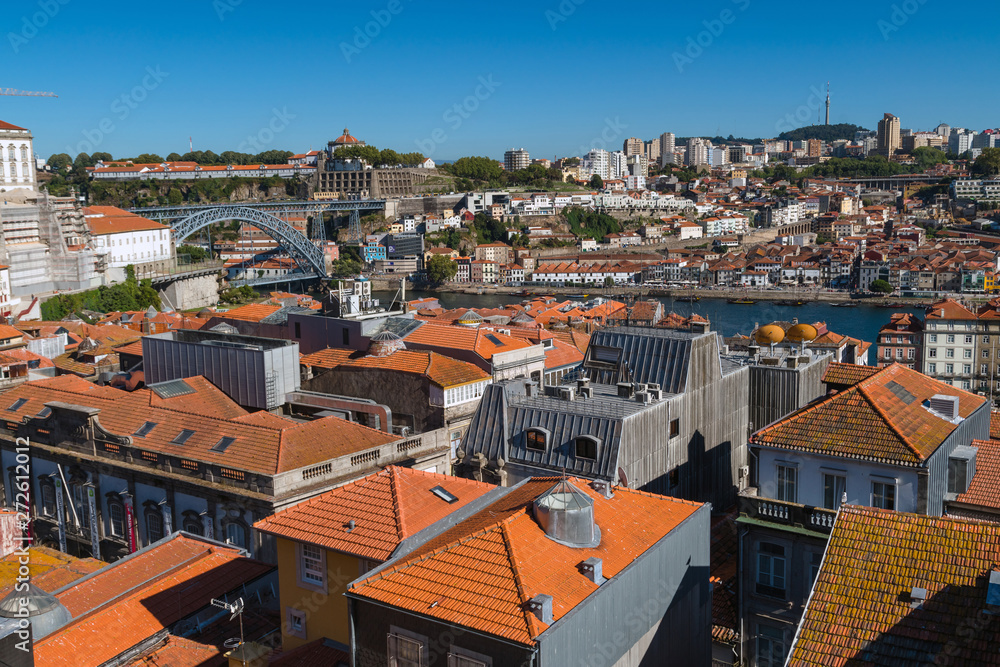 Above the roofs of red tiles overlooking city of Porto, Portugal