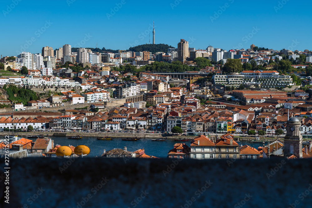Above the roofs of red tiles overlooking city of Porto, Portugal