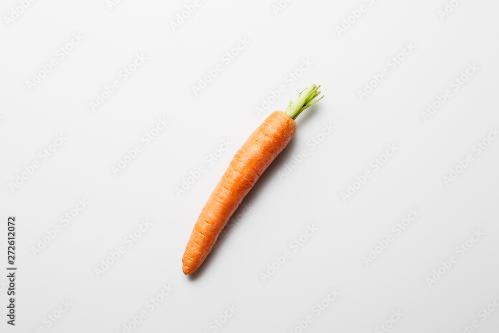 top view of delicious ripe carrot on white background top view of delicious ripe carrot on white background