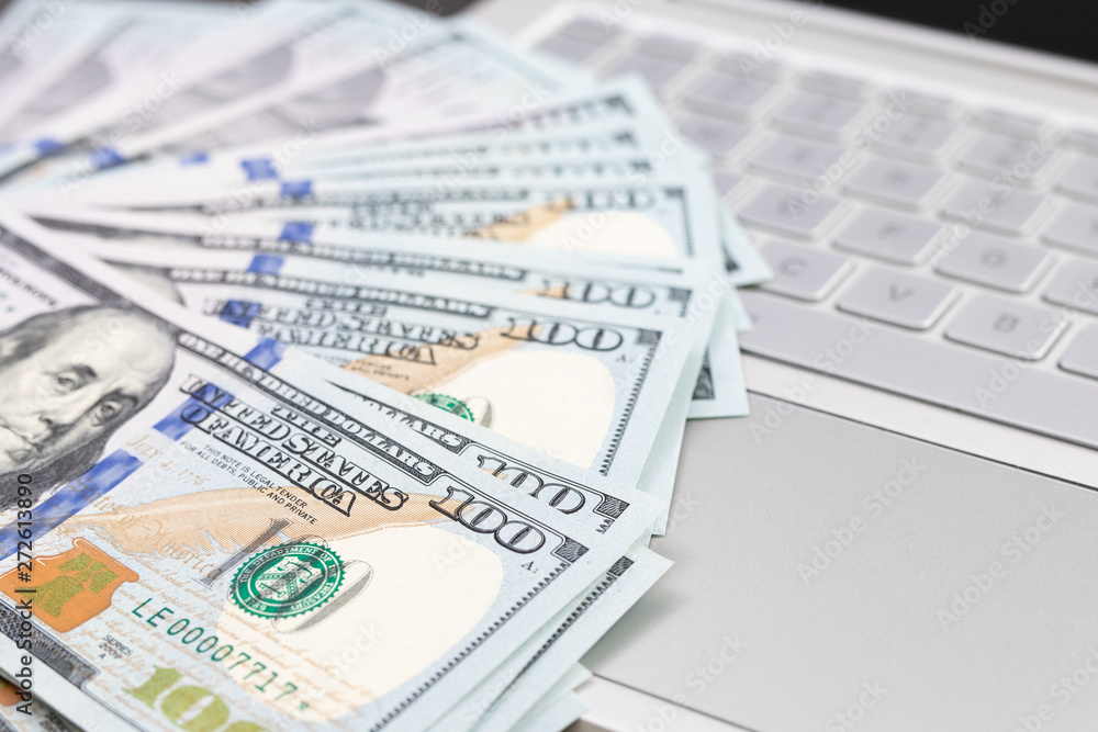 The concept of online payment or transfer. .money near the laptop The concept of online payment or transfer. .money near the laptop