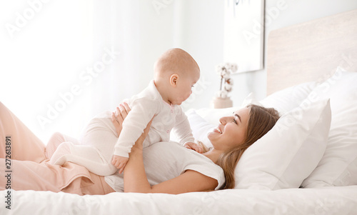 Happy mother with cute litt...