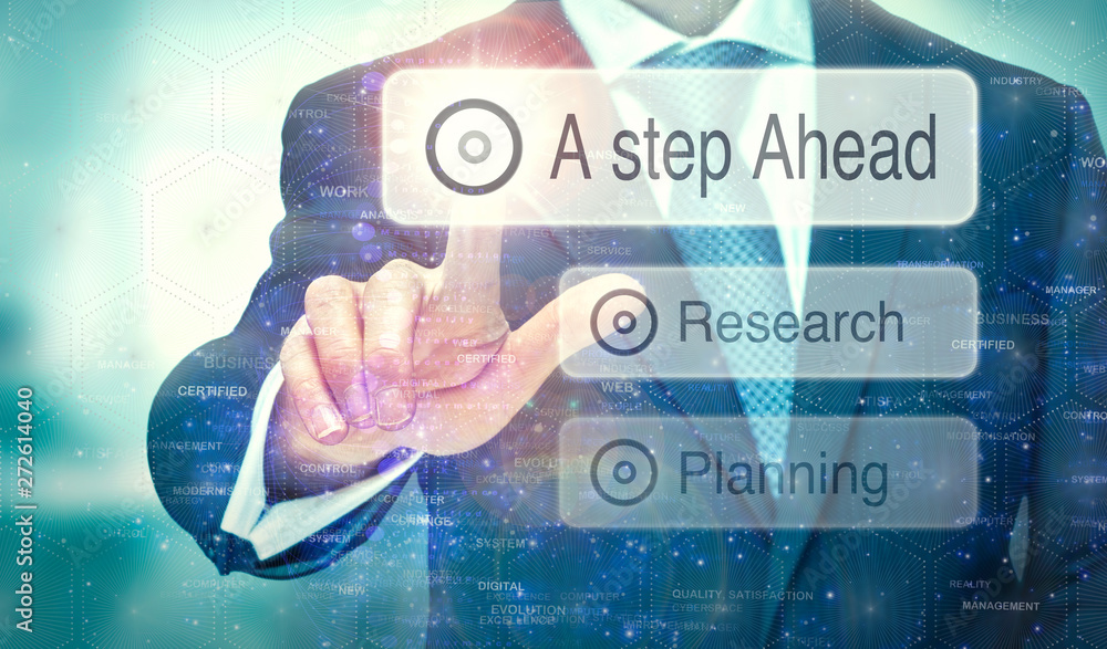A businessman selecting a button on a futuristic display with a A Step Ahead concept written on it. A businessman selecting a button on a futuristic display with a A Step Ahead concept written on it.