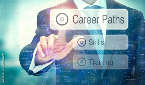 Εκτύπωση καμβά A businessman selecting a button on a futuristic display with a Career Paths concept written on it