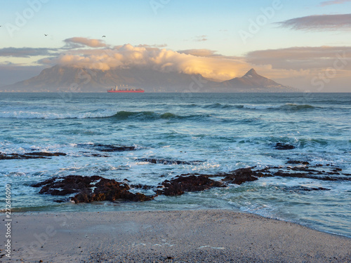Evening view Cape Town, Table Mountain, Devil's Peak and Lion's Head with a ship at sea from Blouberg. Cape Town . Western Cape. South Africa © Roger de la Harpe