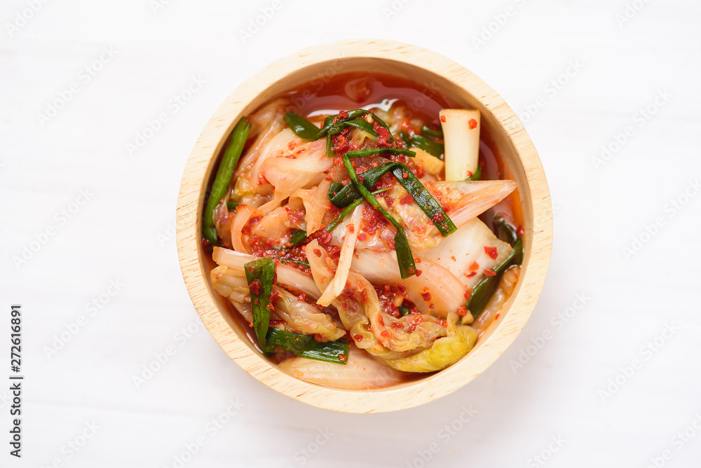 Kimchi cabbage in a bowl on white background, Korean food, top view Kimchi cabbage in a bowl on white background, Korean food, top view