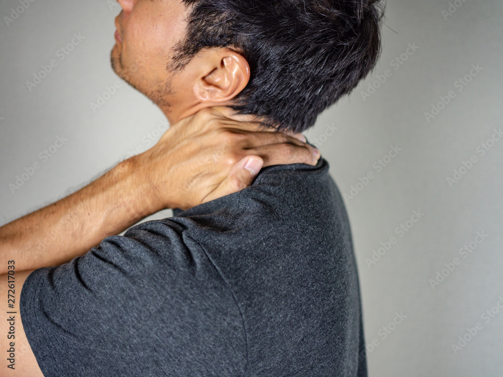 Man massaging neck - shoulder and back pain gesture Man massaging neck - shoulder and back pain gesture