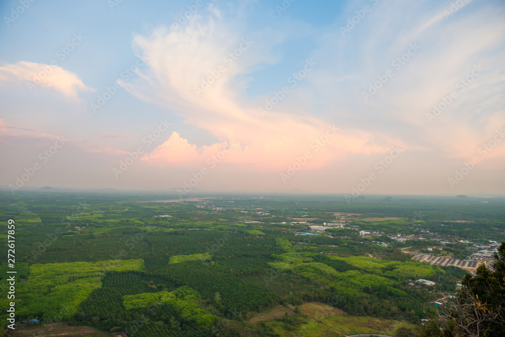Top view of southeast asia countryside landscape with green fields and villages at sunset