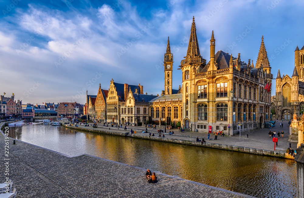 View of Graslei, Korenlei quays and Leie river in the historic city center in Ghent (Gent), Belgium. Architecture and landmark of Ghent. Sunset cityscape of Ghent.