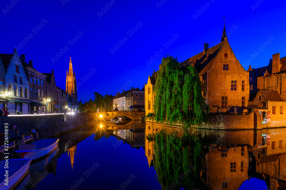 Classic view of the historic city center of Bruges (Brugge), West Flanders province, Belgium. Night cityscape of Bruges.