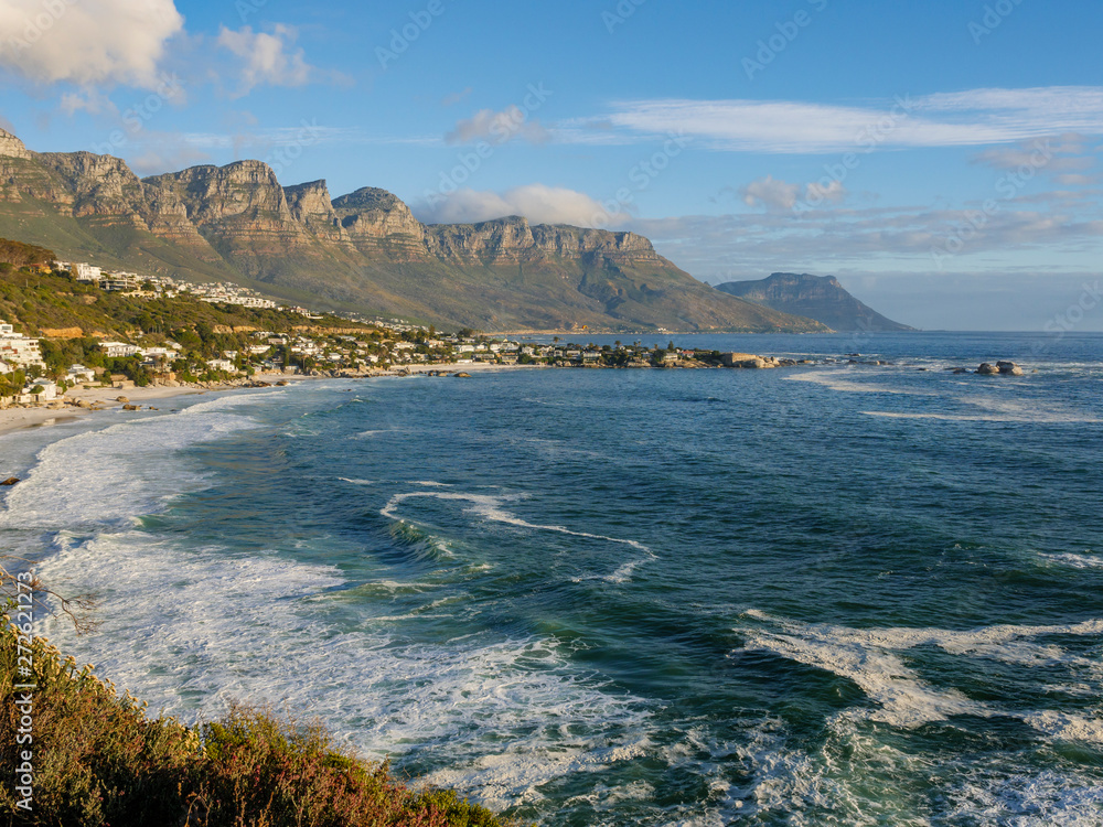 Glorious coastal view along Cape Town's Western Seaboard towards Clifton, Camps Bay and 12 Apostles with Atlantic Ocean waves breaking onto the beach. Cape Town. Western Cape. South Africa.