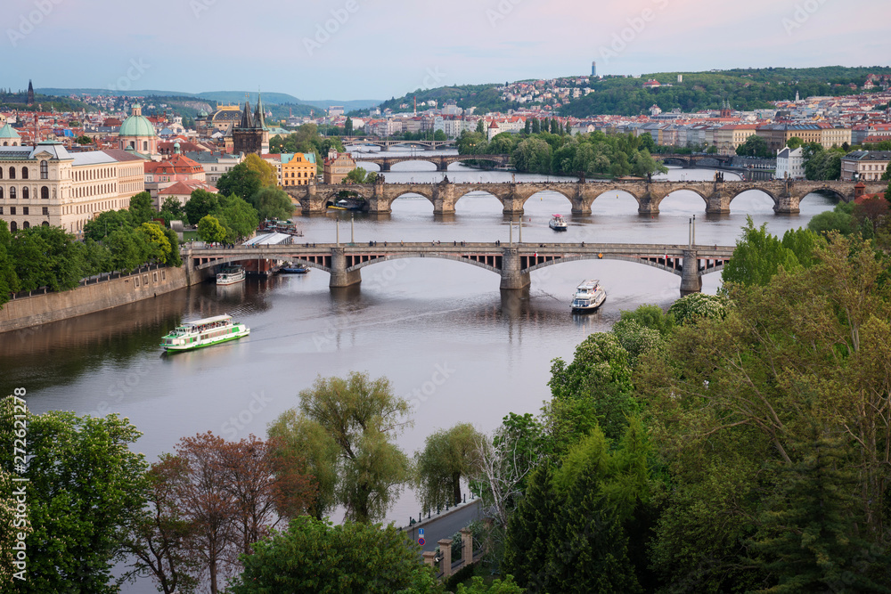 Prague bridges over Vltava River at dusk. Scenic view from Letna Hill, Czech Republic
