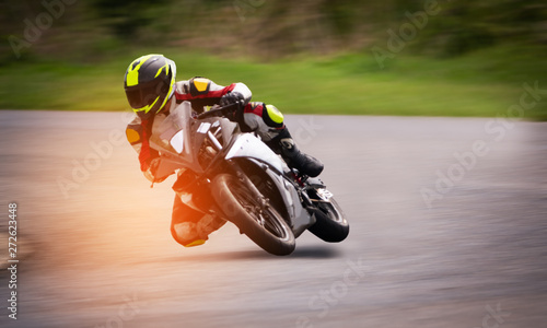 Canvas Print Motorcycle racing on asphalt track.