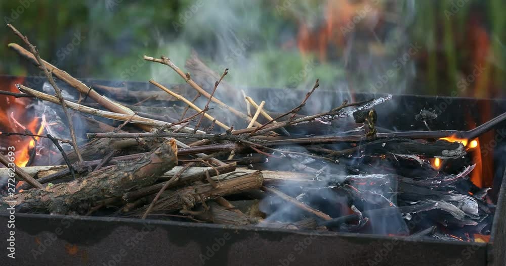 Firewood burning in brazier. Bbq or barbecue preparation. Glowing flame closeup 4K Firewood burning in brazier. Bbq or barbecue preparation. Glowing flame closeup 4K