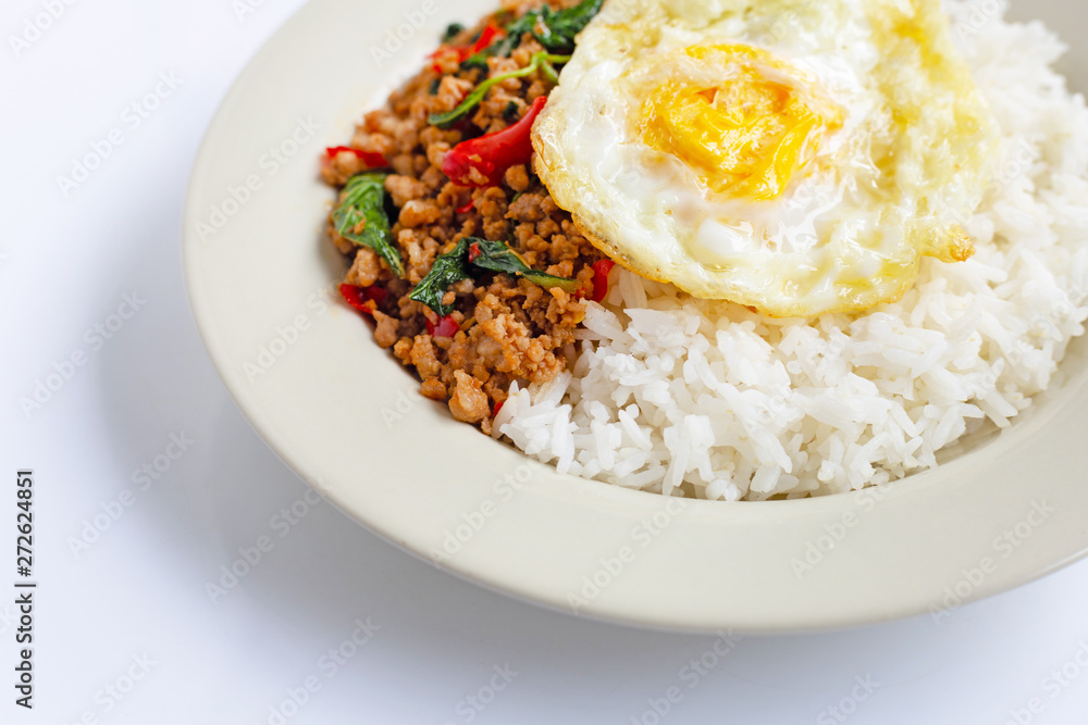 Rice topped with stir-fried pork with basil and fried egg Rice topped with stir-fried pork with basil and fried egg
