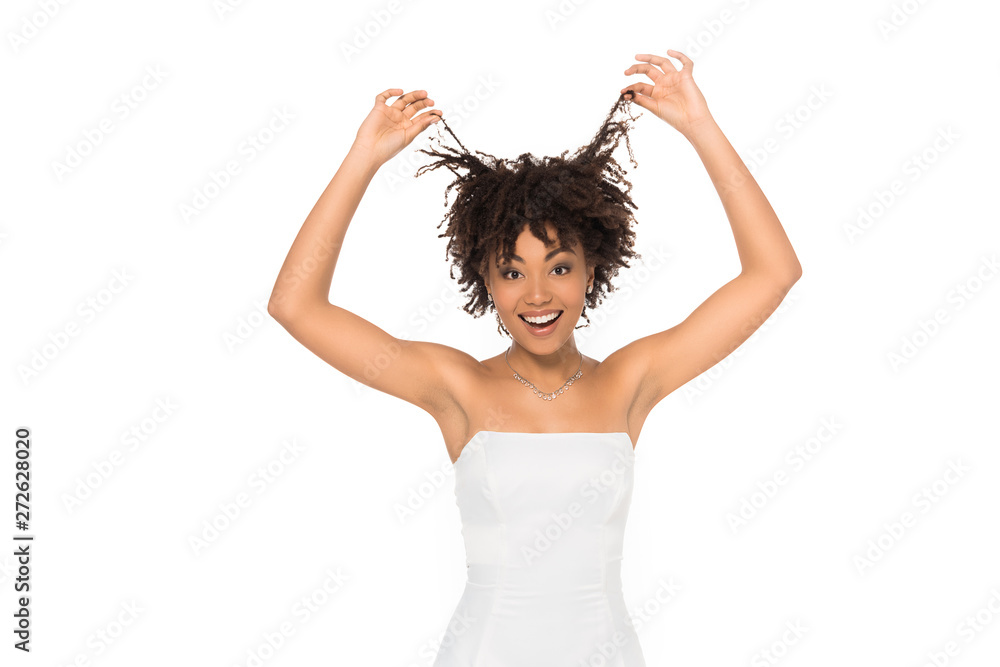 happy african american bride smiling while touching hair isolated on white happy african american bride smiling while touching hair isolated on white