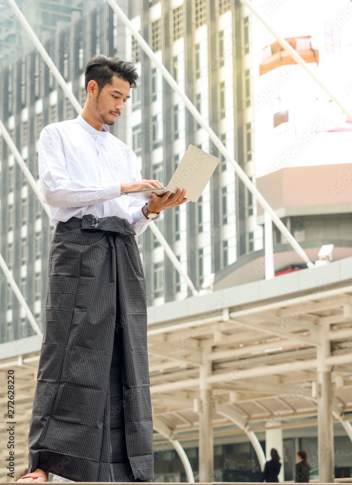 Young Burmese businessman find data in laptop ,It's time to talk about business Young Burmese businessman find data in laptop ,It's time to talk about business