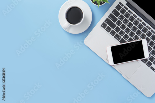 Business concept, relaxation in working time, drinking coffee taking a break on clean light blue office table, copy space, flat lay, top view, mockup