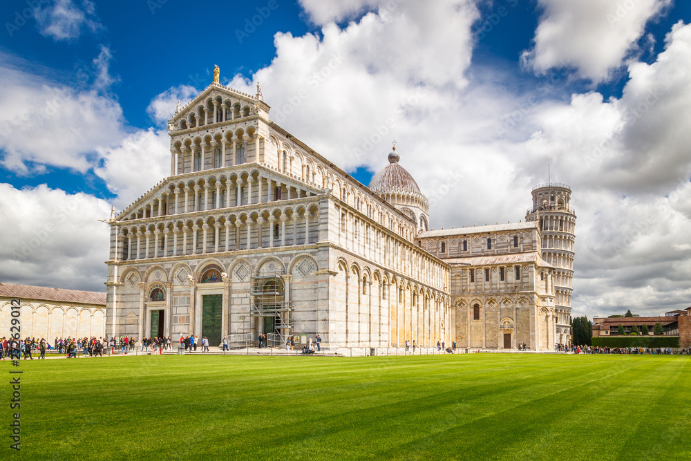 Pisa Cathedral with the Leaning Tower of Pisa in Square of Miracles at sunny day, Tuscany region, Italy.