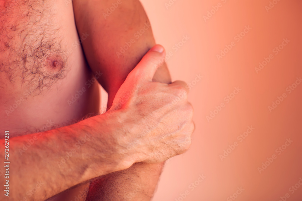 Man feels pain in elbow. People, healthcare and medicine concept