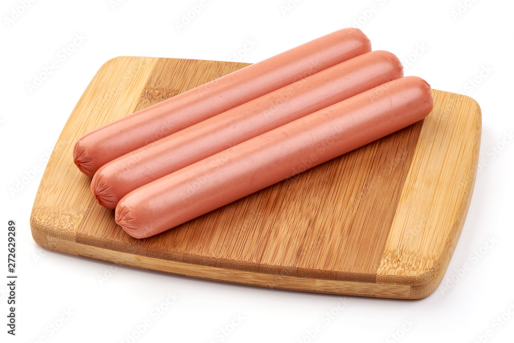 Fresh pork hot dog sausages on a cutting board, for barbeque or grill, close-up, isolated on white background Fresh pork hot dog sausages on a cutting board, for barbeque or grill, close-up, isolated on white background