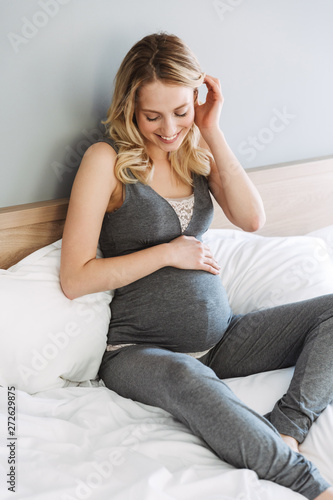 Attractive young pregnant blonde woman