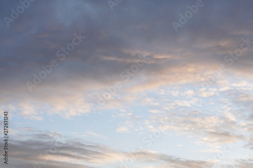 Fototapeta Naklejka Na Ścianę i Meble -  Fluffy cloud sunset skies . Nature background . Texture