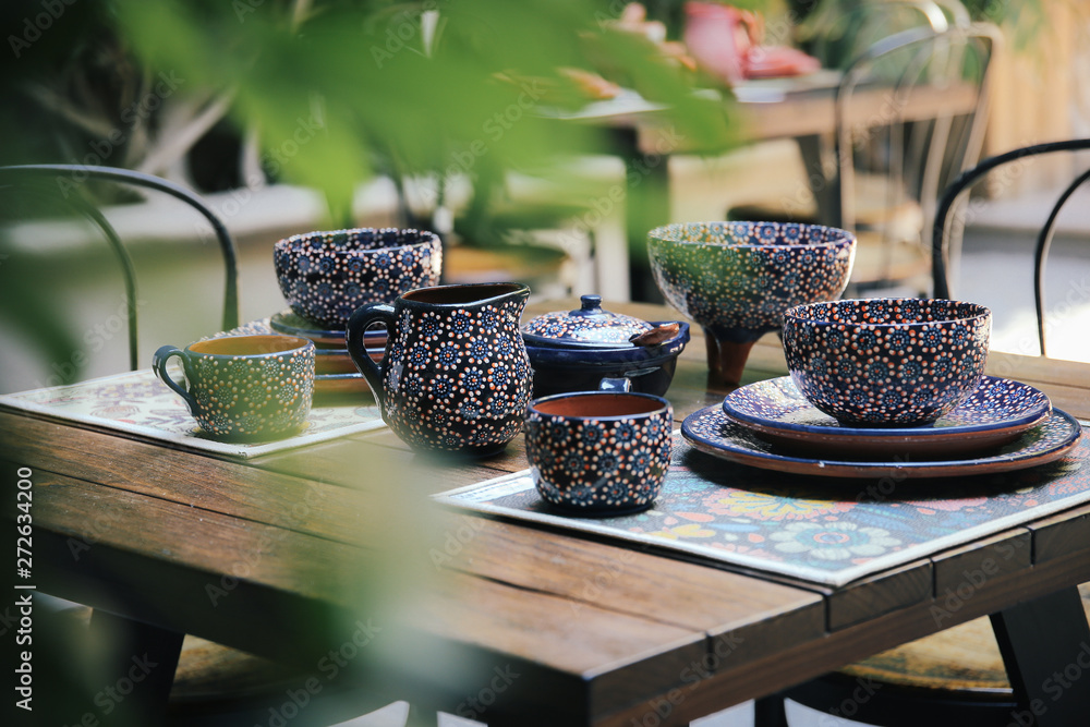 A hand painted blue and red dinnerware
