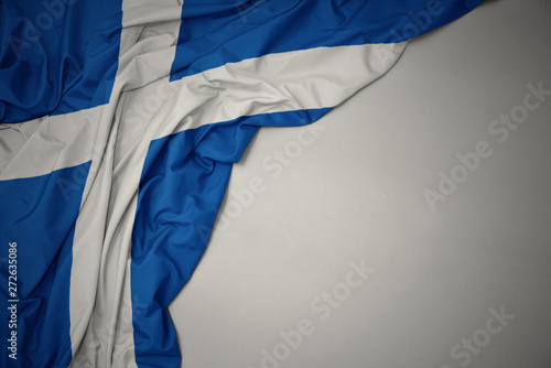 Vászonkép waving national flag of scotland on a gray background.