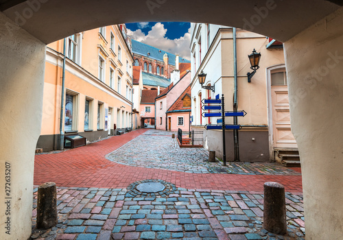 Papier peint Medieval convent yard and spire of St Peter church in old Riga-capital of Latvia