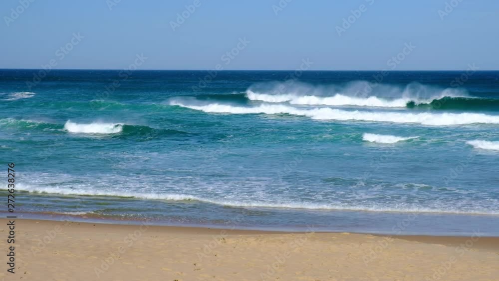 Tropical beach aerial view, Top view of waves break on tropical white sand beach. Sea waves seamless loop on the beautiful sand beach. Tropical beach aerial view, Top view of waves break on tropical white sand beach. Sea waves seamless loop on the beautiful sand beach.
