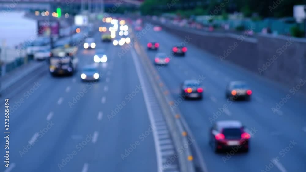 Defocused Night City Traffic Lights. Color Blurred bokeh of moving transport and typical city view Defocused Night City Traffic Lights. Color Blurred bokeh of moving transport and typical city view