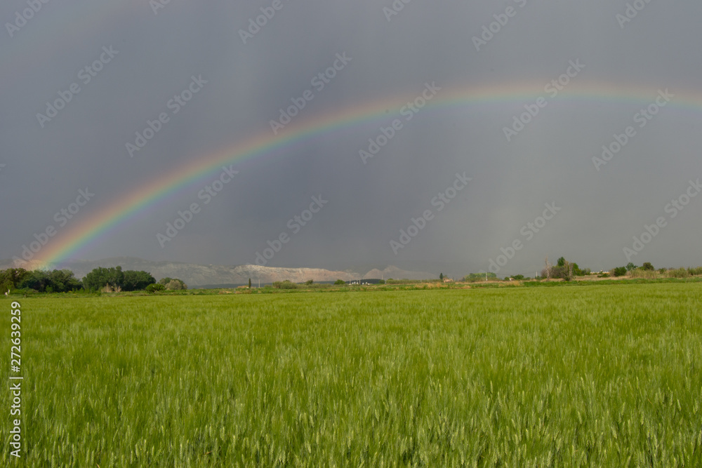Beautiful storm landscape surroundings of Zaragoza rain rainbow and horizon hills Beautiful storm landscape surroundings of Zaragoza rain rainbow and horizon hills