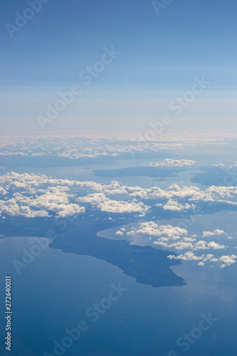 Landscape from the plane clouds and water