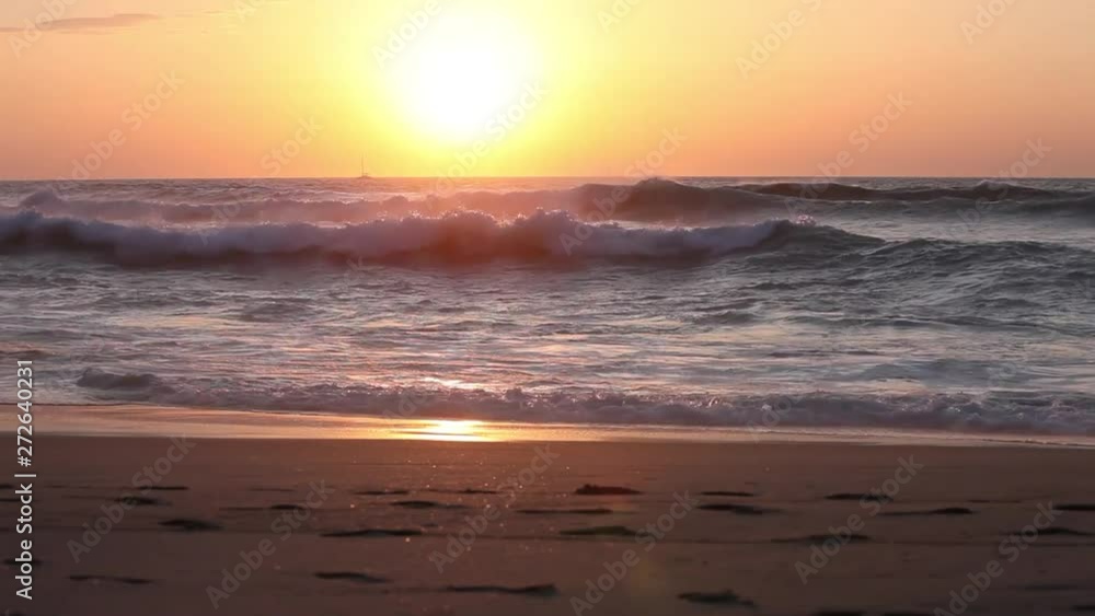 Amazing sunset over the tropical beach. Ocean waves on beach at sunset time, sunlight reflect on water surface. beautiful evening nature sea background. Amazing sunset over the tropical beach. Ocean waves on beach at sunset time, sunlight reflect on water surface. beautiful evening nature sea background.