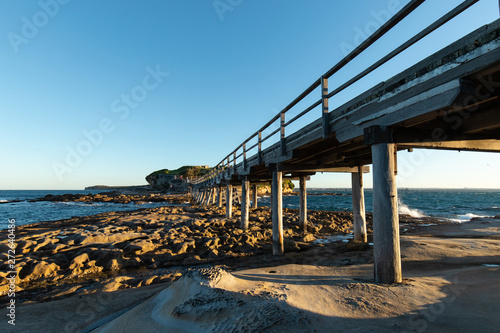 A view under the wooden bridge towards Bare Island. La Perouse, Sydney, Australia. photo